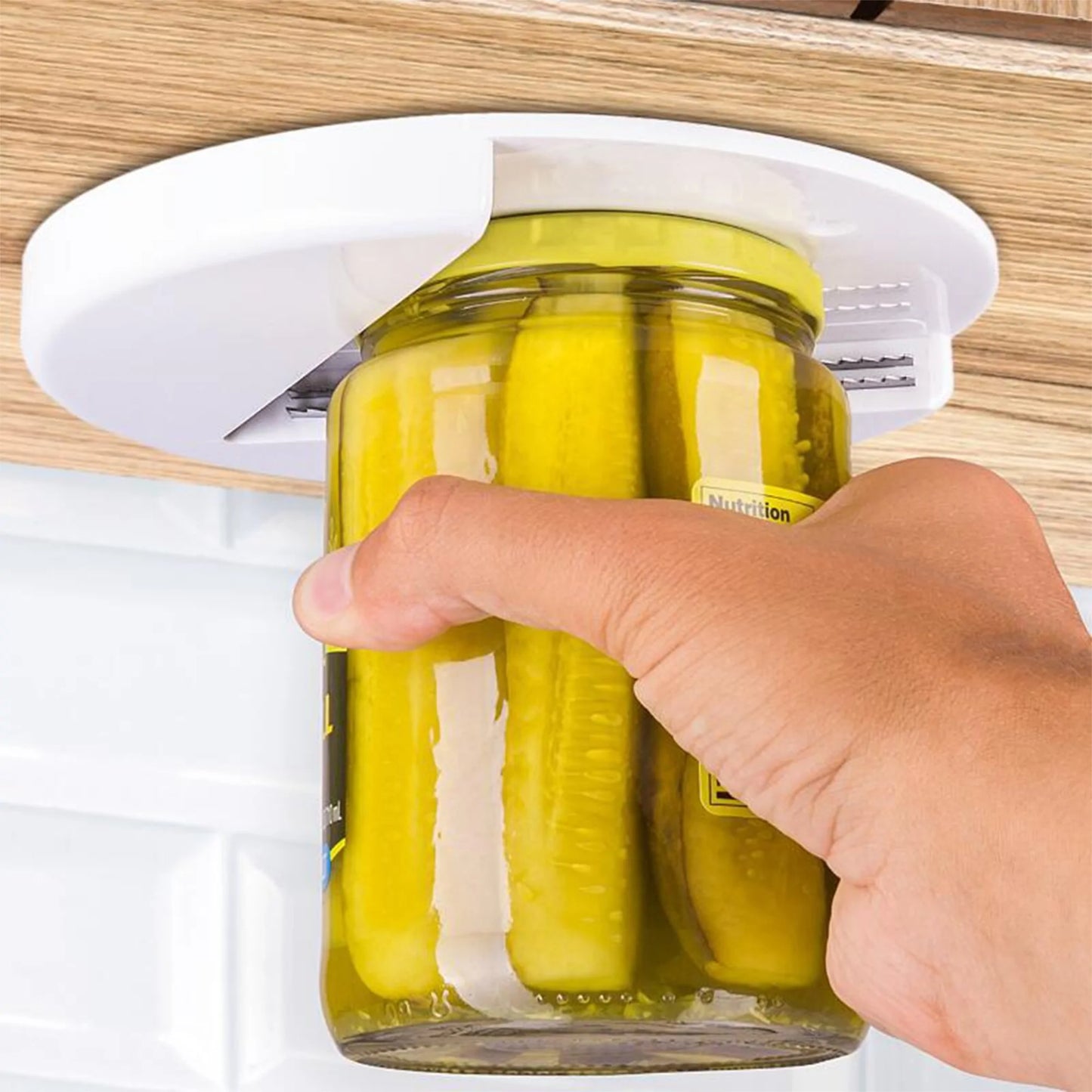 EZ Twist pain-free jar opener mounted under cabinet opening pickle jar effortlessly